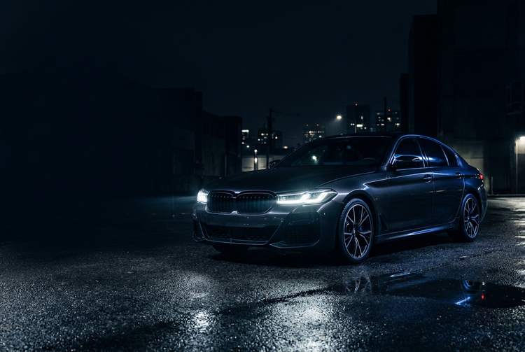 Car with its headlights on at night